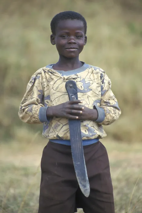 Framed Print : Portrait of a little boy with a big knife