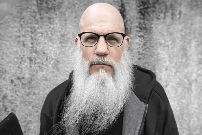 Framed Print : Portrait of mature bald man with long gray beard against grunge concrete wall outdoors Framed Print : Portrait of mature bald man with long gray beard against grunge concrete wall outdoors