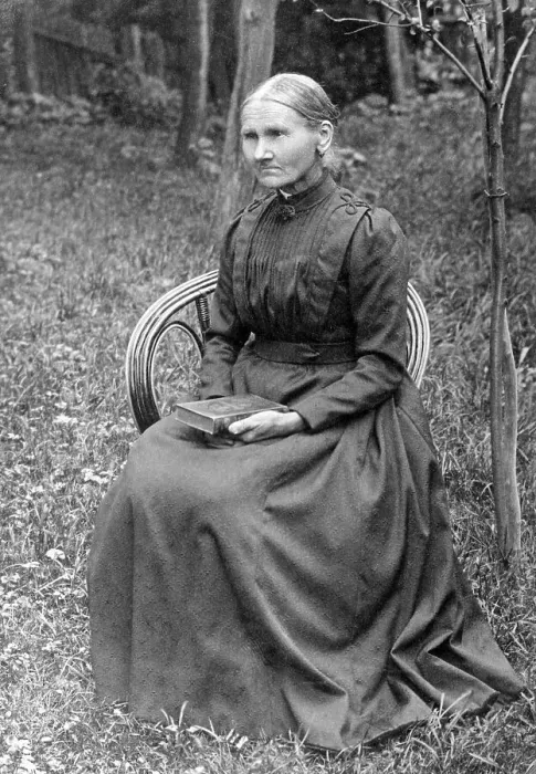 Framed Print : Portrait, old woman sitting on a chair