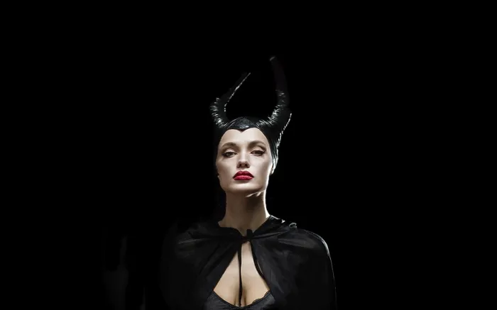 Framed Print : A portrait of a woman in a dark costume with horns and dramatic expression