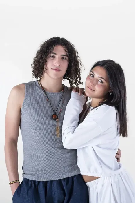 Framed Print : Portrait of a young couple dressed in yoga clothes looking ti the camera white background Framed Print : Portrait of a young couple dressed in yoga clothes looking ti the camera white background