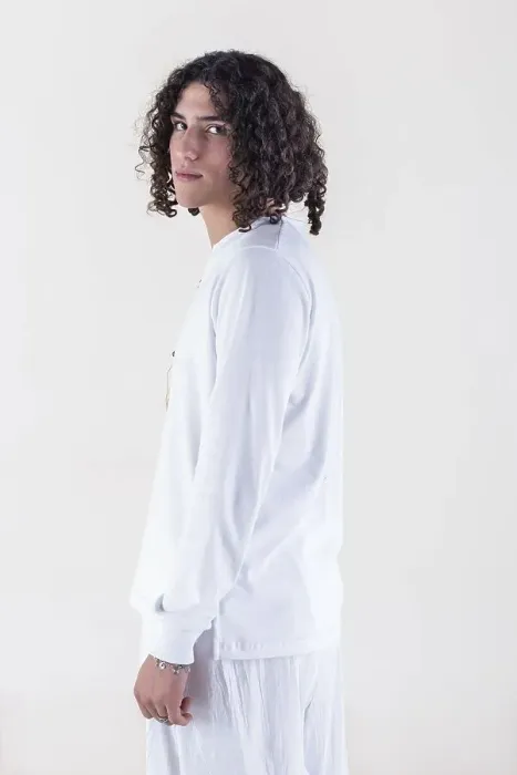 Framed Print : Portrait of a young man dressed in white yoga clothes over white background while looking at camera Framed Print : Portrait of a young man dressed in white yoga clothes over white background while looking at camera