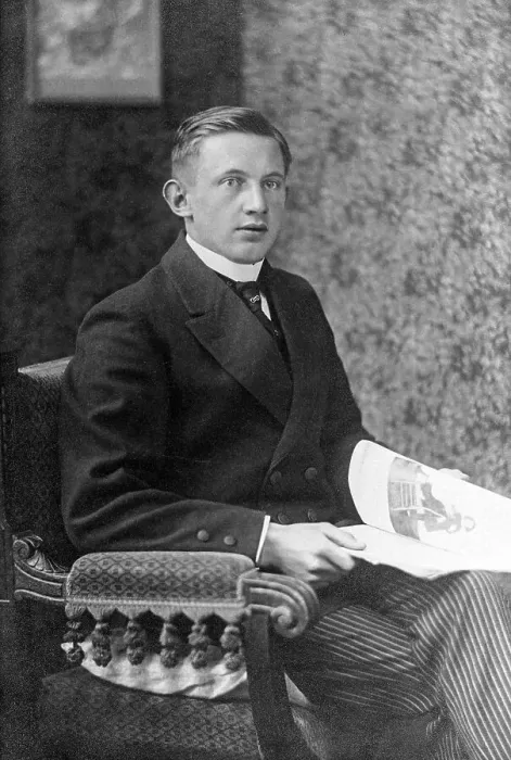 Framed Print : Portrait, young man sitting in an armchair with a newspaper Framed Print : Portrait, young man sitting in an armchair with a newspaper