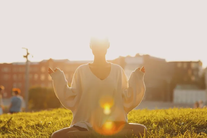 Framed Print : Portrait of young millenial european short haired woman doing yoga lotus asana on green grass meadow summer park sunset Framed Print : Portrait of young millenial european short haired woman doing yoga lotus asana on green grass meadow summer park sunset