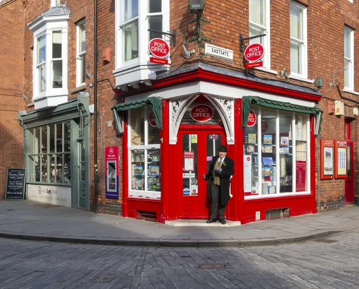 Framed Print : Post Office corner shop painted bright red