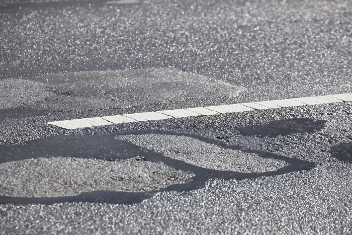 Framed Print : Pothole in the road surface, Germany