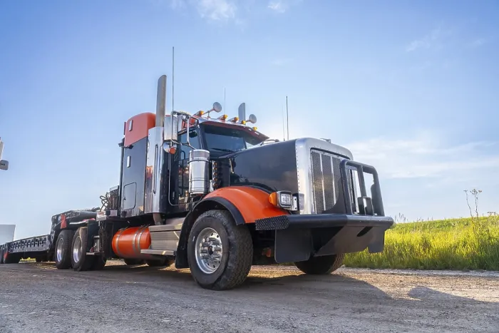 Framed Print : Powerful big rig semi truck with empty flatbed trailer parked on hemlock grove boardwalk in the canadian rockies