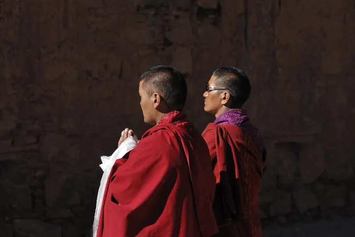 Framed Print : Praying monks, Paelkhor Monastery Complex