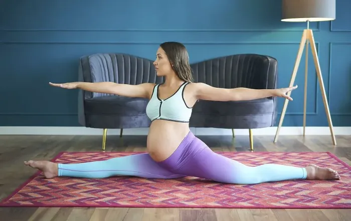 Framed Print : Pregnant sporty woman practicing yoga at home doing stretching exercise the side split pose Hanumanasana Framed Print : Pregnant sporty woman practicing yoga at home doing stretching exercise the side split pose Hanumanasana