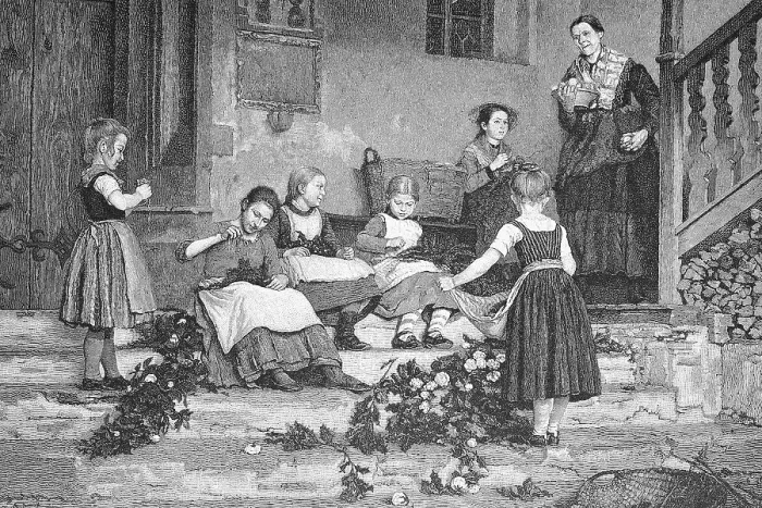 Framed Print : Preparations for the festival, children tying flower garlands