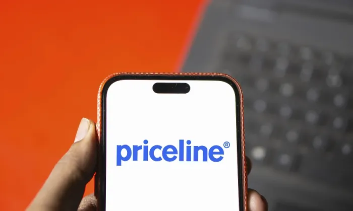 Framed Print : priceline logo is displayed on smartphone