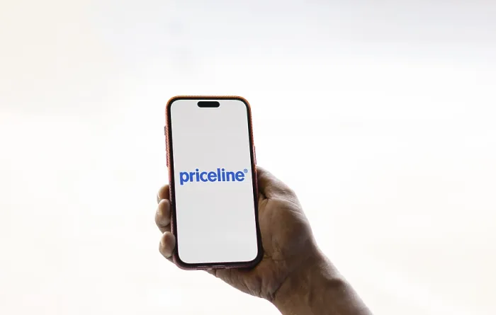 Framed Print : priceline logo is displayed on smartphone