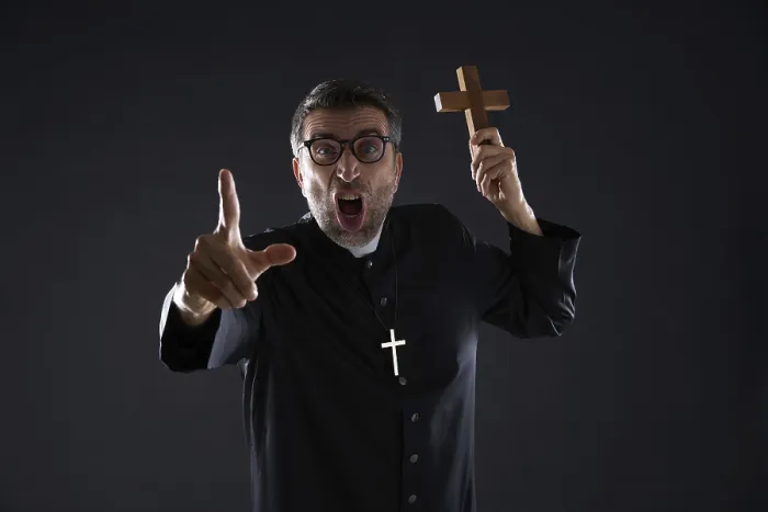 Framed Print : Priest holding cross of wood praying and shouting Framed Print : Priest holding cross of wood praying and shouting