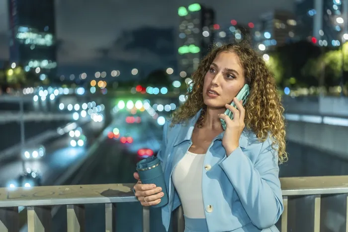 Framed Print : Professional businesswoman standing on a city bridge at night Framed Print : Professional businesswoman standing on a city bridge at night