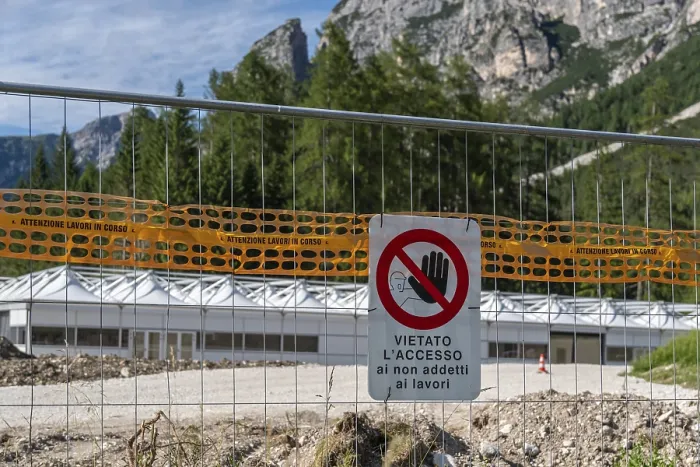Framed Print : Prohibition sign on construction site barrier in front of mountain backdrop