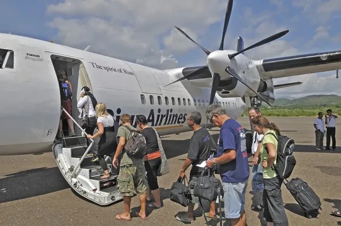 Framed Print : Propeller aircraft, prop jet Fokker 50, former Riau Airlines, passengers at the airport in Labuan Bajo, Flores Island, Indonesia, Asia