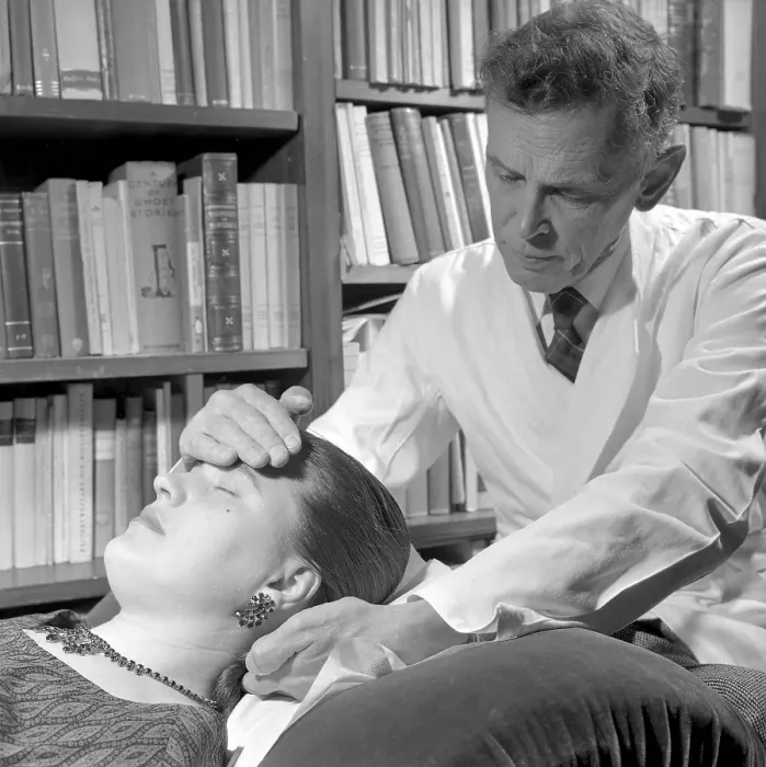 Framed Print : At the Psychologist. A woman is lying on a couch in a psychologist