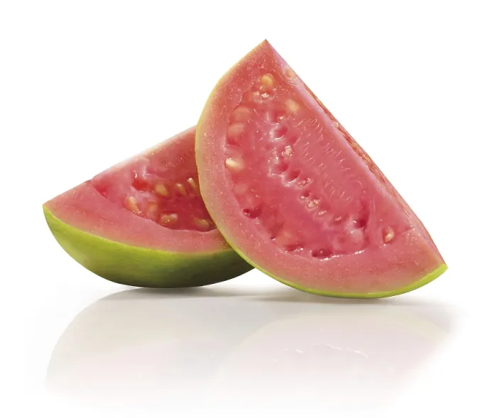 Framed Print : Two quarters of a sliced guava (Psidium guajava) in front of a white background