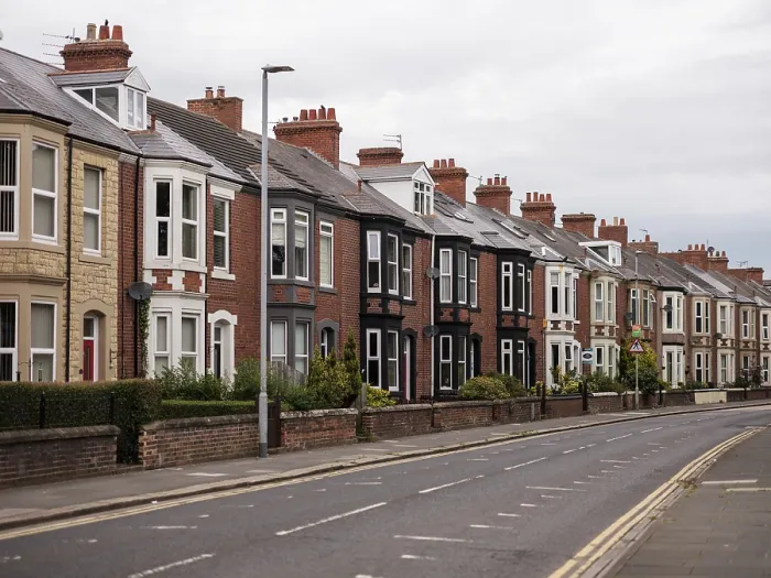 Framed Print : A quiet residential street featuring a row of traditional terraced houses in Blyth