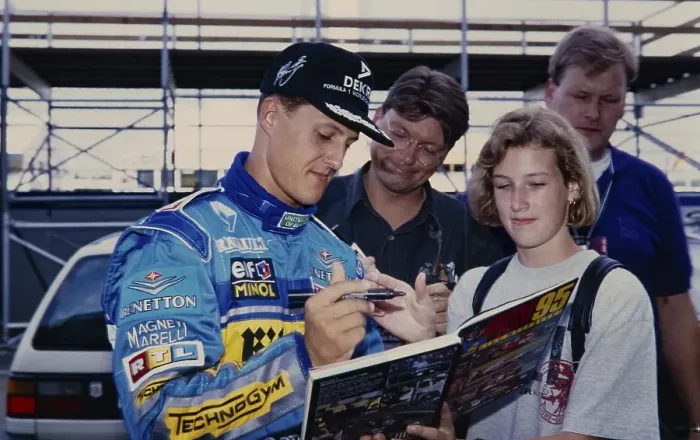 Framed Print : Racing driver Michael Schumacher (Benetton Ford), in blue racing suit gives a fan an autograph, Formula 1 Grand Prix at the Hockenheimring on 30 June 1995, Germany, Europe