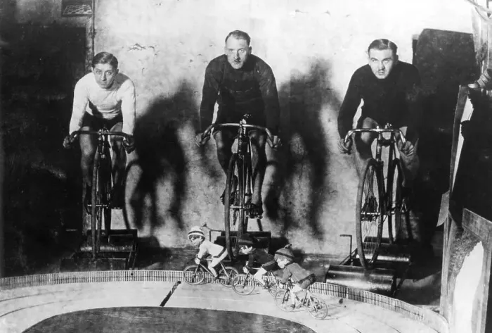 Framed Print : Three racing drivers with toy racing figures