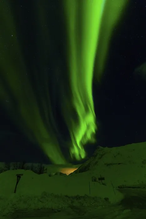 Framed Print : Radiant green aurora borealis streaks across a star-filled sky