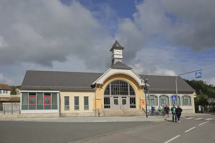 Framed Print : Railway station with tourist office and pedestrians