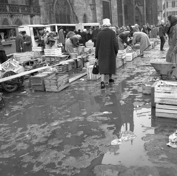 Framed Print : Rain puddles on the market place