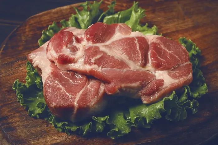 Framed Print : Raw pork steak, two pieces, on a wooden background