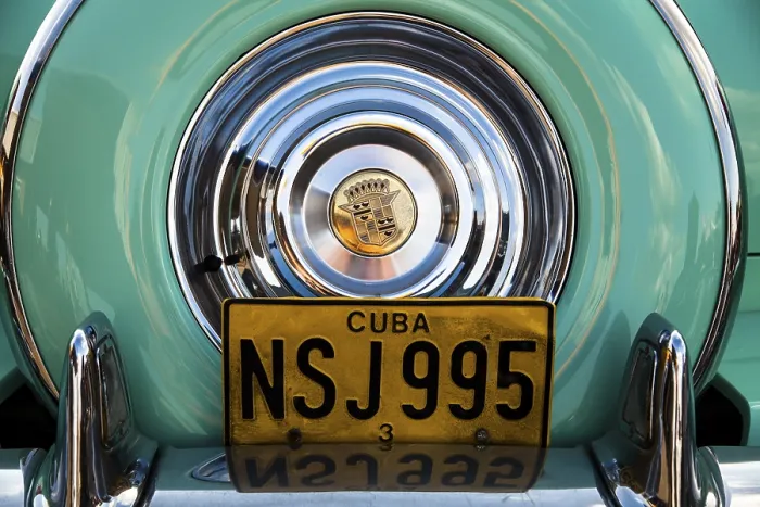 Framed Print : Rear view of an old Cadillac, spare wheel cover