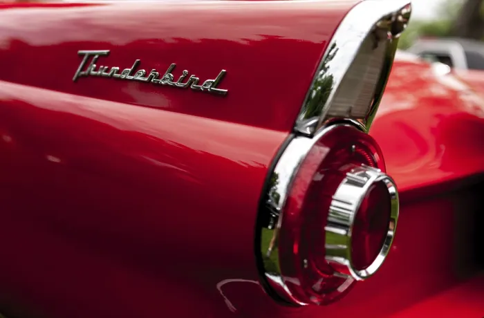 Framed Print : Rear view of a red classic Thunderbird highlighting its tail light and emblem in St