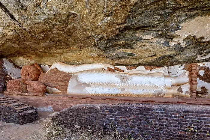 Framed Print : Reclining Buddha embedded in a rock wall