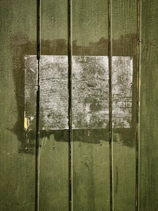 Framed Print : A rectangular patch on a green wooden surface shows faded remnants of a past application Framed Print : A rectangular patch on a green wooden surface shows faded remnants of a past application