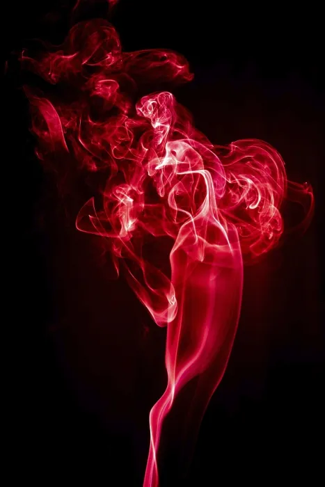 Framed Print : Red abstract shaped smoke against black background