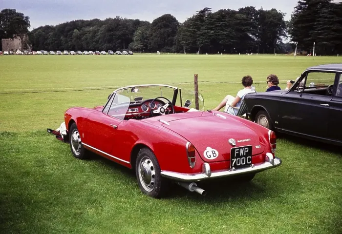 Framed Print : Red Alfa Romeo Spider 1600 at a polo match Cirencester, Gloucestershire, England, UK around 1967