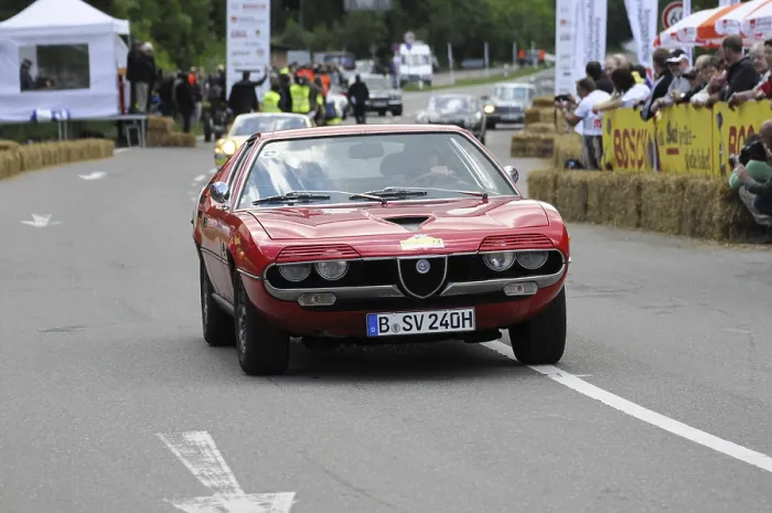 Framed Print : A red Alfa Romeo sports car on the road at a classic car rally