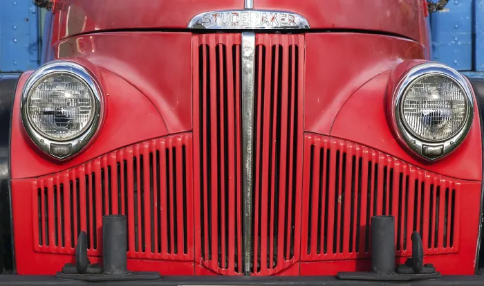 Framed Print : Red bonnet, radiator grille and lamps