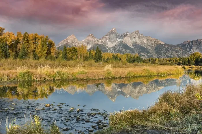 Framed Print : Red clouds at sunrise, Grand Teton Range mountain range reflected in the river