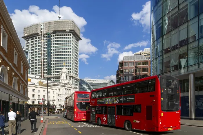 Framed Print : Red double-decker buses in street by Victoria palace theatre