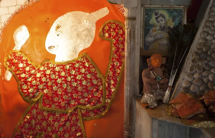 Framed Print : Red dressed god in a Rajasthan tempple