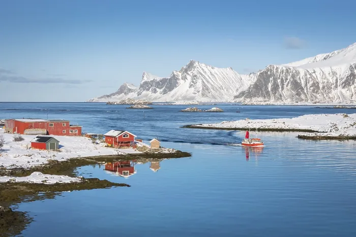 Framed Print : Red farmhouse and fishing boat are reflected in the fjord Rossoy Straumen