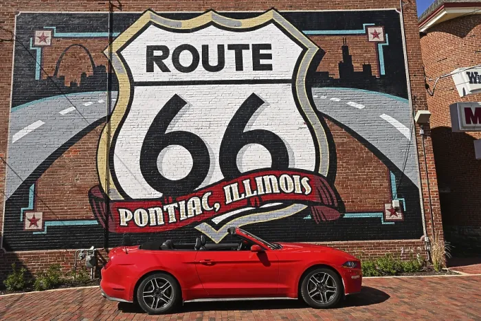Framed Print : Red Ford Mustang convertible in front of the mural with the motif Route 66