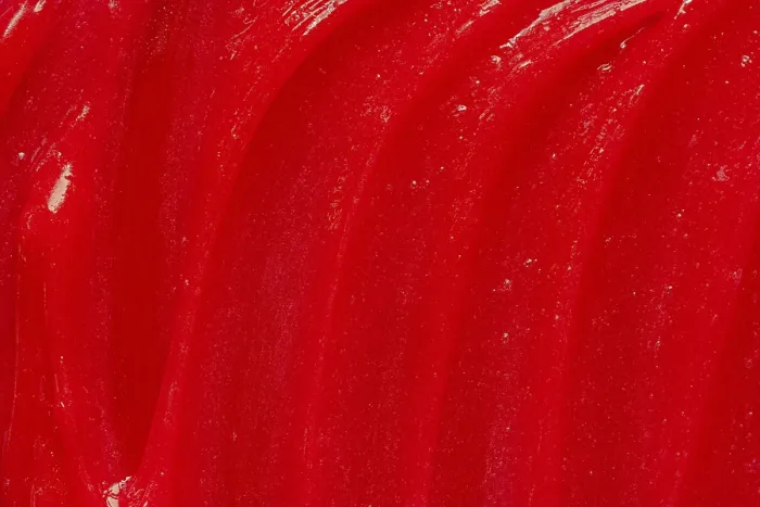 Framed Print : Red gel texture. Cosmetic clear liquid cream smudge
