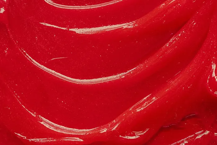 Framed Print : Red gel texture. Cosmetic clear liquid cream smudge