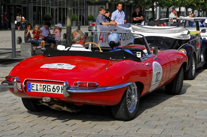 Framed Print : Red Jaguar E-Type convertible at a car event with spectators Framed Print : Red Jaguar E-Type convertible at a car event with spectators