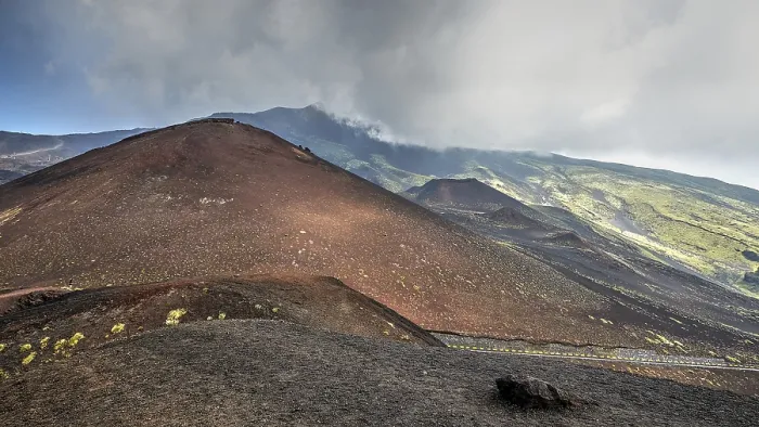 Framed Print : Red lava hill, cloudy sky, black crater Framed Print : Red lava hill, cloudy sky, black crater