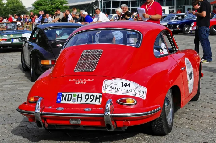 Framed Print : Red Porsche with audience in the urban setting of a classic car event