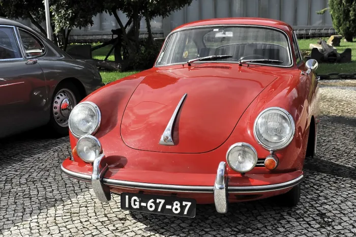 Framed Print : Red Porsche classic car seen from the front on a cobblestone Framed Print : Red Porsche classic car seen from the front on a cobblestone