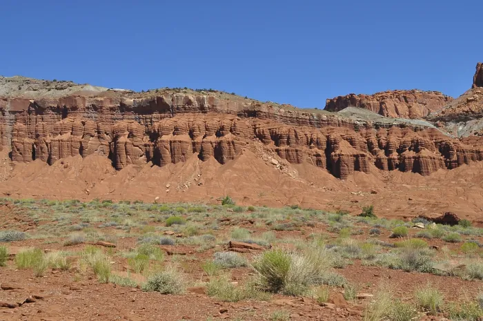 Framed Print : Red rock formation with low desert vegetation