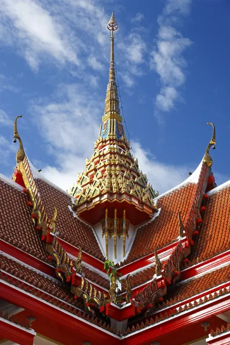 Framed Print : Red roof of a pagoda with an ornate spire